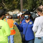 State Rep. Daisy Morales speaks with Florida Division of Emergency Management workers during her free COVID vaccination event in 2020. Photo: J Willie David III / Florida National News.
